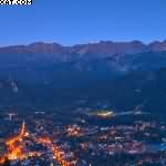 Night panorama of Zakopane against the Tatras, Poland.